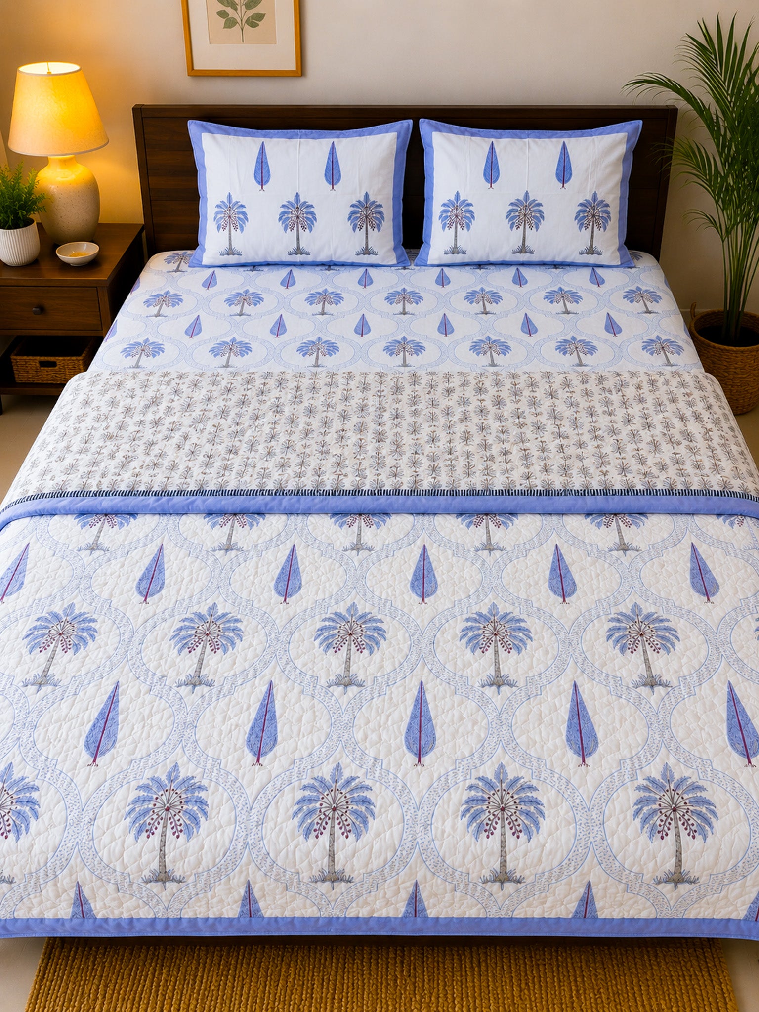 ORA Living Indigo Palm Frame Handblock Reversible Pure Mulmul Cotton Quilt shown with both printed sides