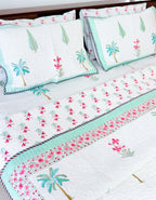 Palm and Pink Floral quilted bedcover full bed view.