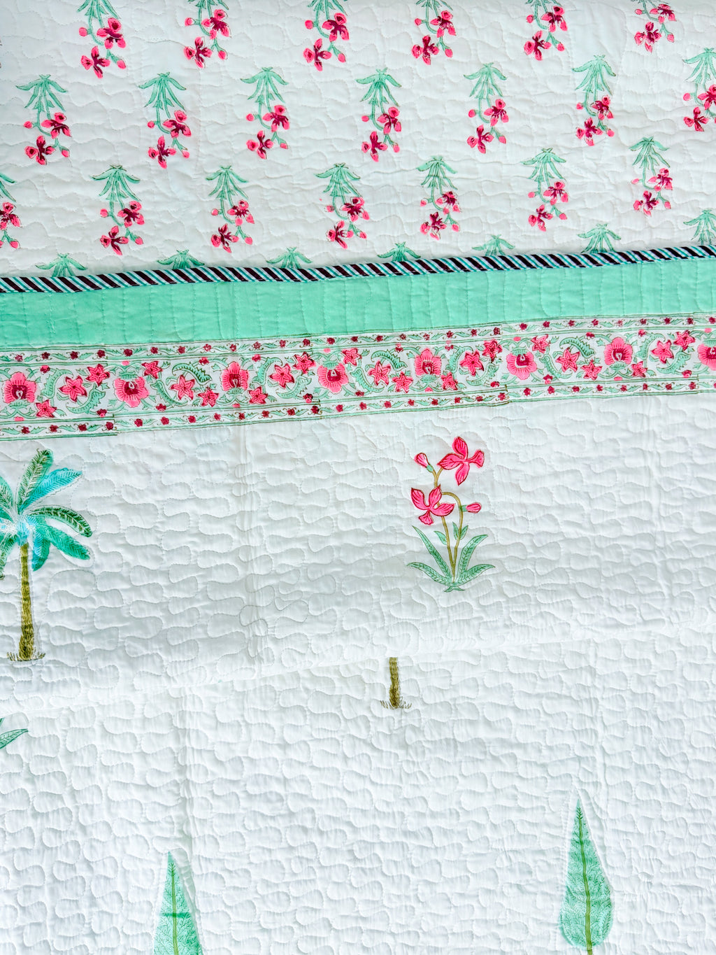 Palm and Pink Floral quilted bedcover quilted texture view.