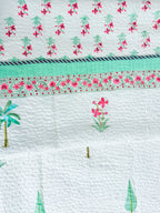Palm and Pink Floral quilted bedcover quilted texture view.