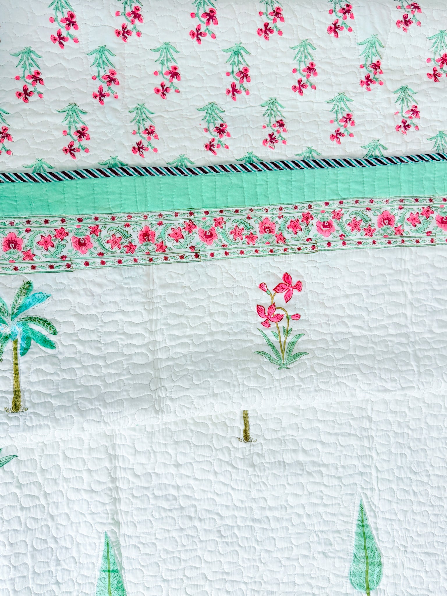 Palm and Pink Floral quilted bedcover quilted texture view.