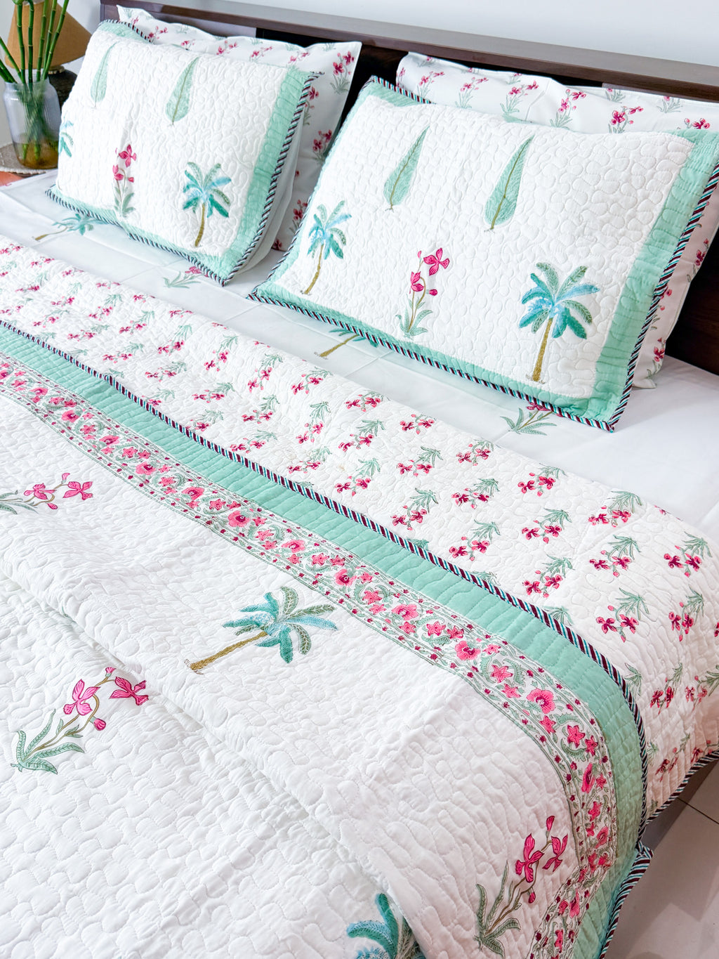 Palm and Pink Floral quilted bedcover full product view.