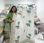 ORA Living Elephant Palm Handblock Reversible Pure Mulmul Cotton Quilt shown with both printed sides
