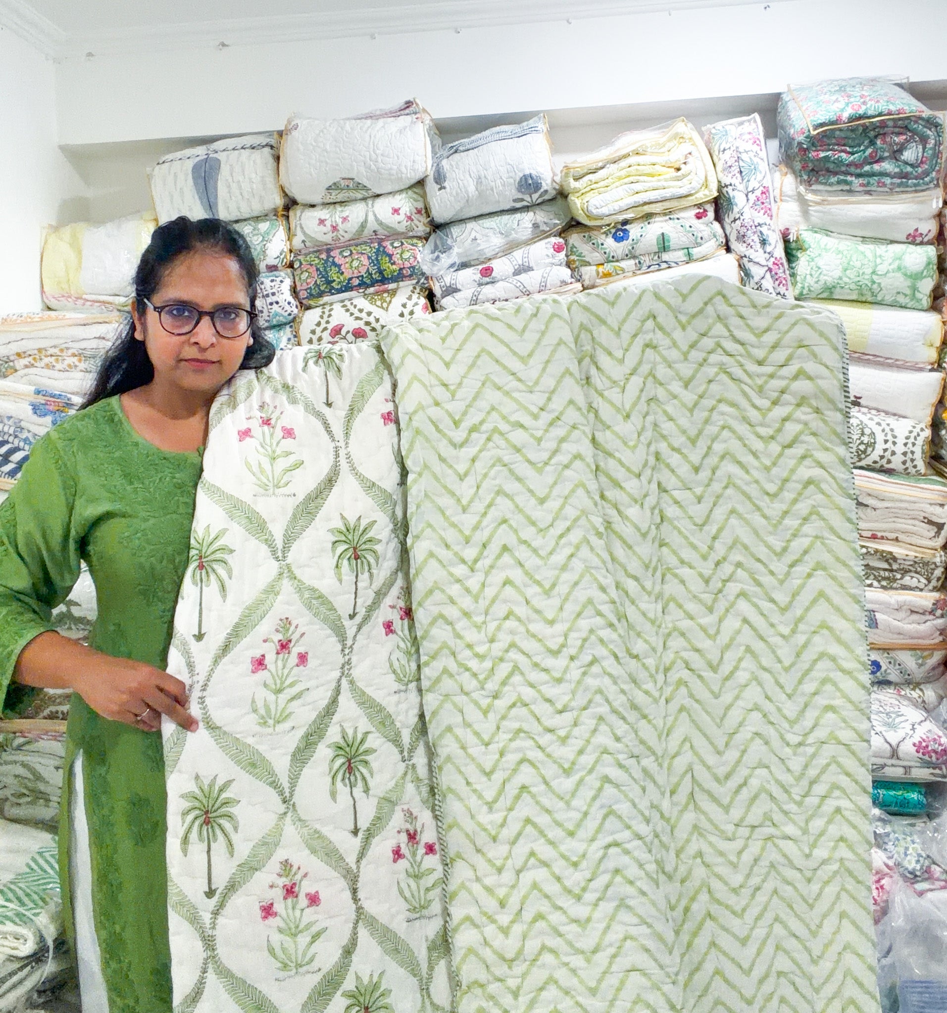ORA Living Pink Floral Palm Handblock Reversible Pure Mulmul Cotton Quilt shown with both printed sides