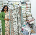 ORA Living Peach Floral Handblock Reversible Pure Mulmul Cotton Quilt shown with both printed sides