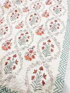 Floral side detail of ORA Living Sage and Rust Floral Handblock Reversible Pure Mulmul Cotton Quilt