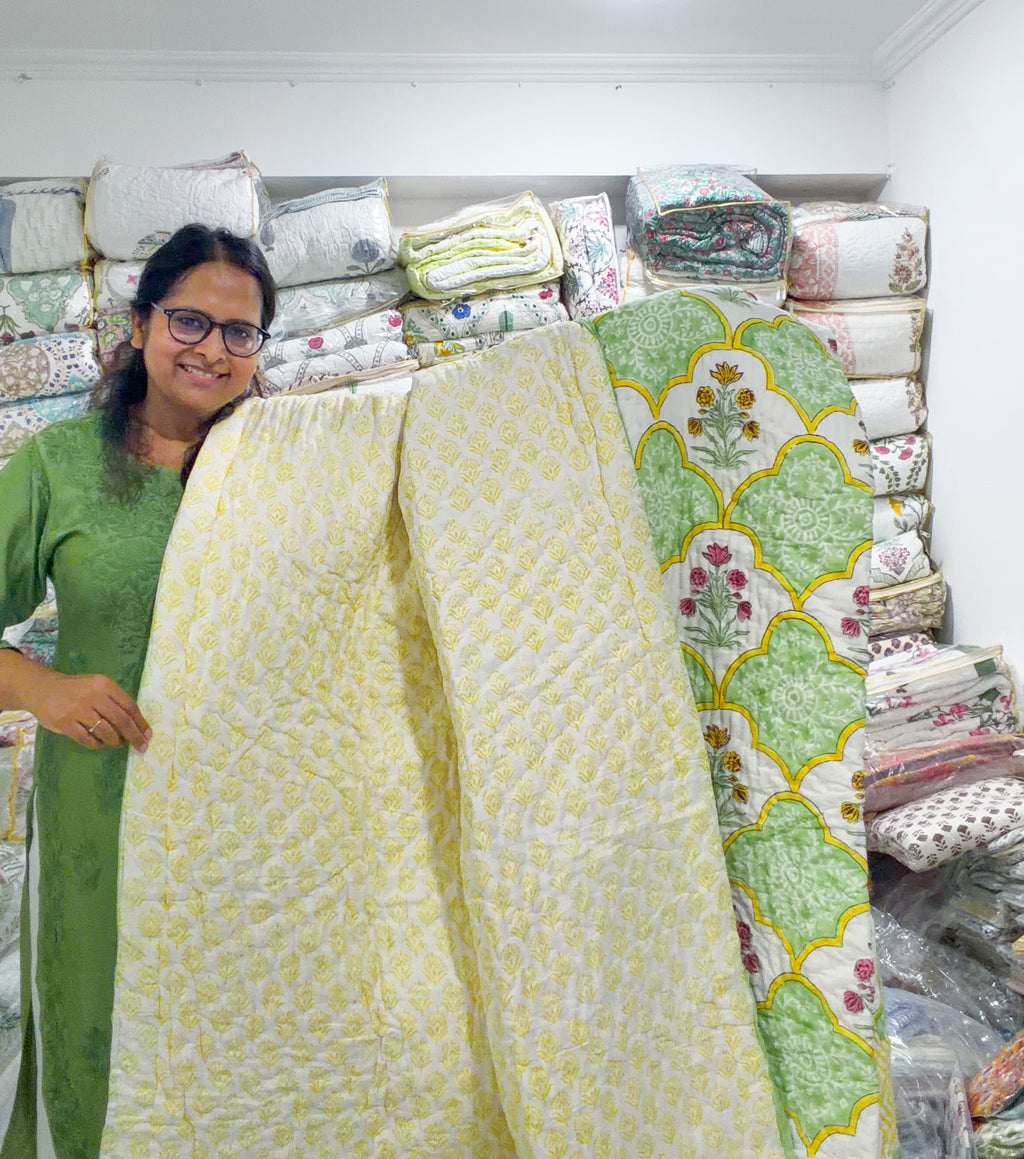 ORA Living Gardenia Floral Handblock Reversible Pure Mulmul Cotton Quilt shown with both printed sides