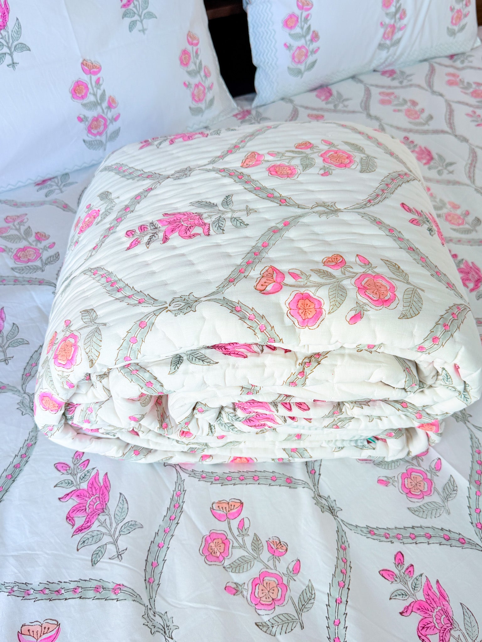 ORA Living Rose Jal Handblock Reversible Pure Mulmul Cotton Quilt shown with both printed sides