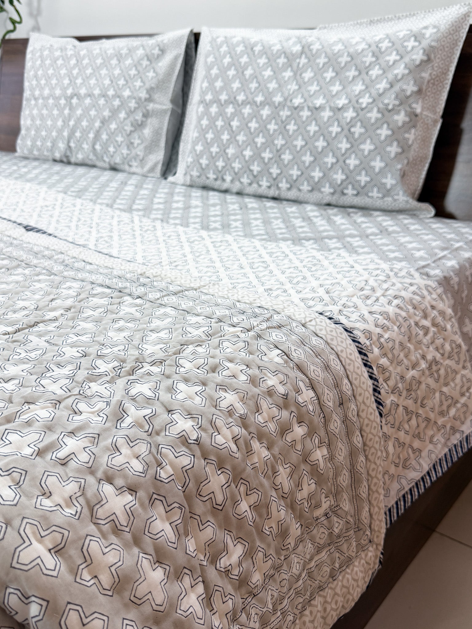 Grey and white cross print detail of ORA Living Grey Cross Handblock Reversible Pure Mulmul Cotton Quilt