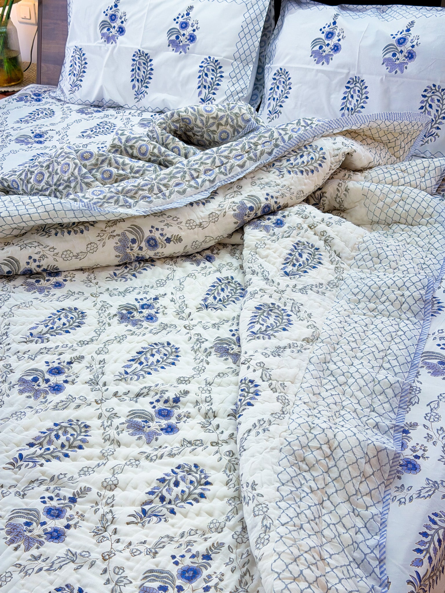 ORA Living Blue Grey Floral Handblock Reversible Pure Mulmul Cotton Quilt shown with both printed sides