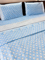 ORA Living Blue Cross Handblock Reversible Pure Mulmul Cotton Dohar styled on a bed