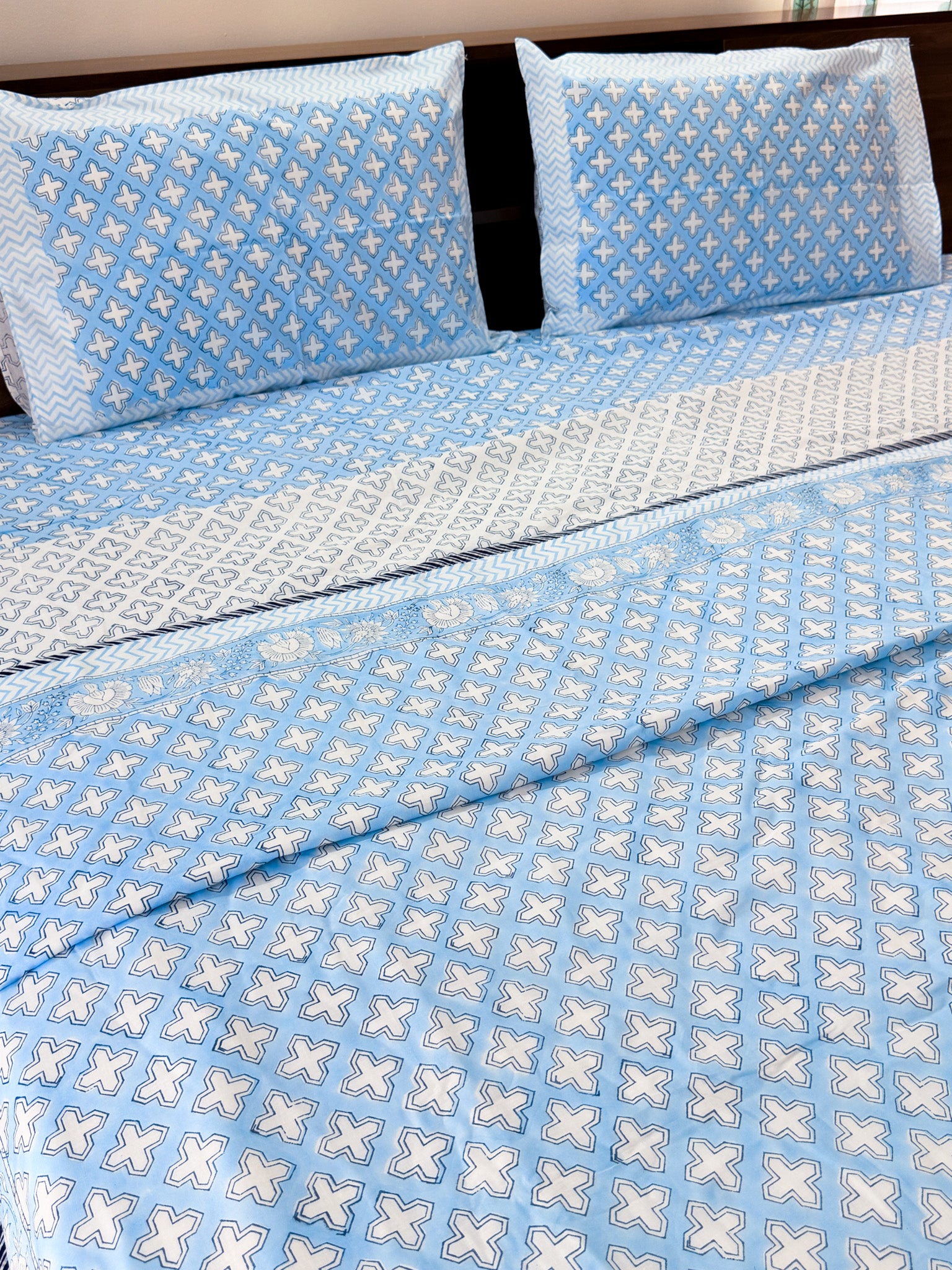ORA Living Blue Cross Handblock Reversible Pure Mulmul Cotton Dohar styled on a bed