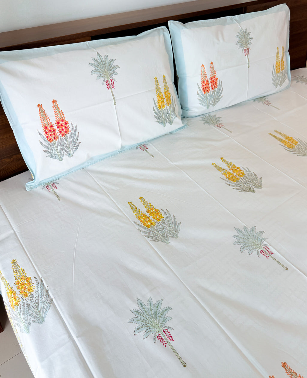Cotton fabric detail of ORA Living Red Yellow Wildflower Handblock Premium Cotton Bedsheet Set