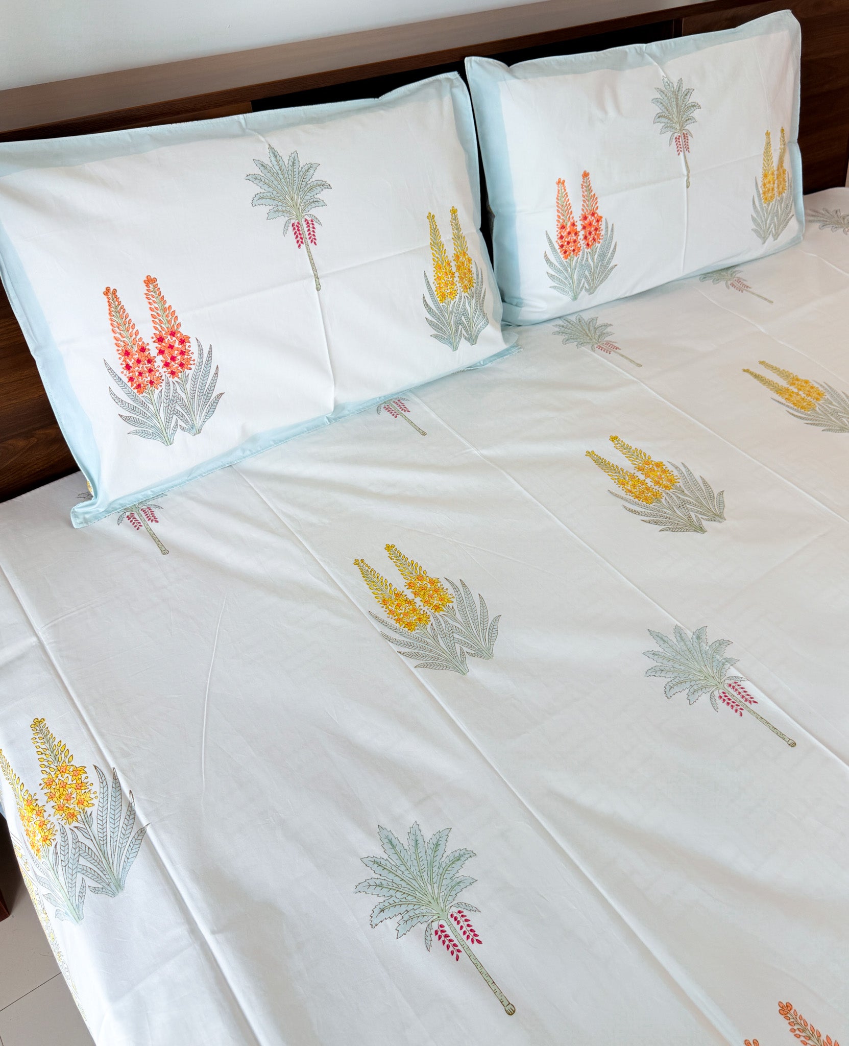 Cotton fabric detail of ORA Living Red Yellow Wildflower Handblock Premium Cotton Bedsheet Set