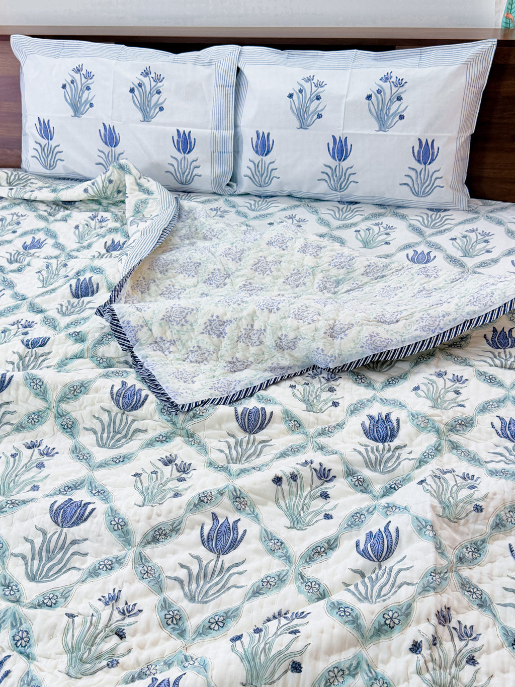 ORA Living Blue Flower Sage Leaf Handblock Reversible Pure Mulmul Cotton Quilt shown with both printed sides