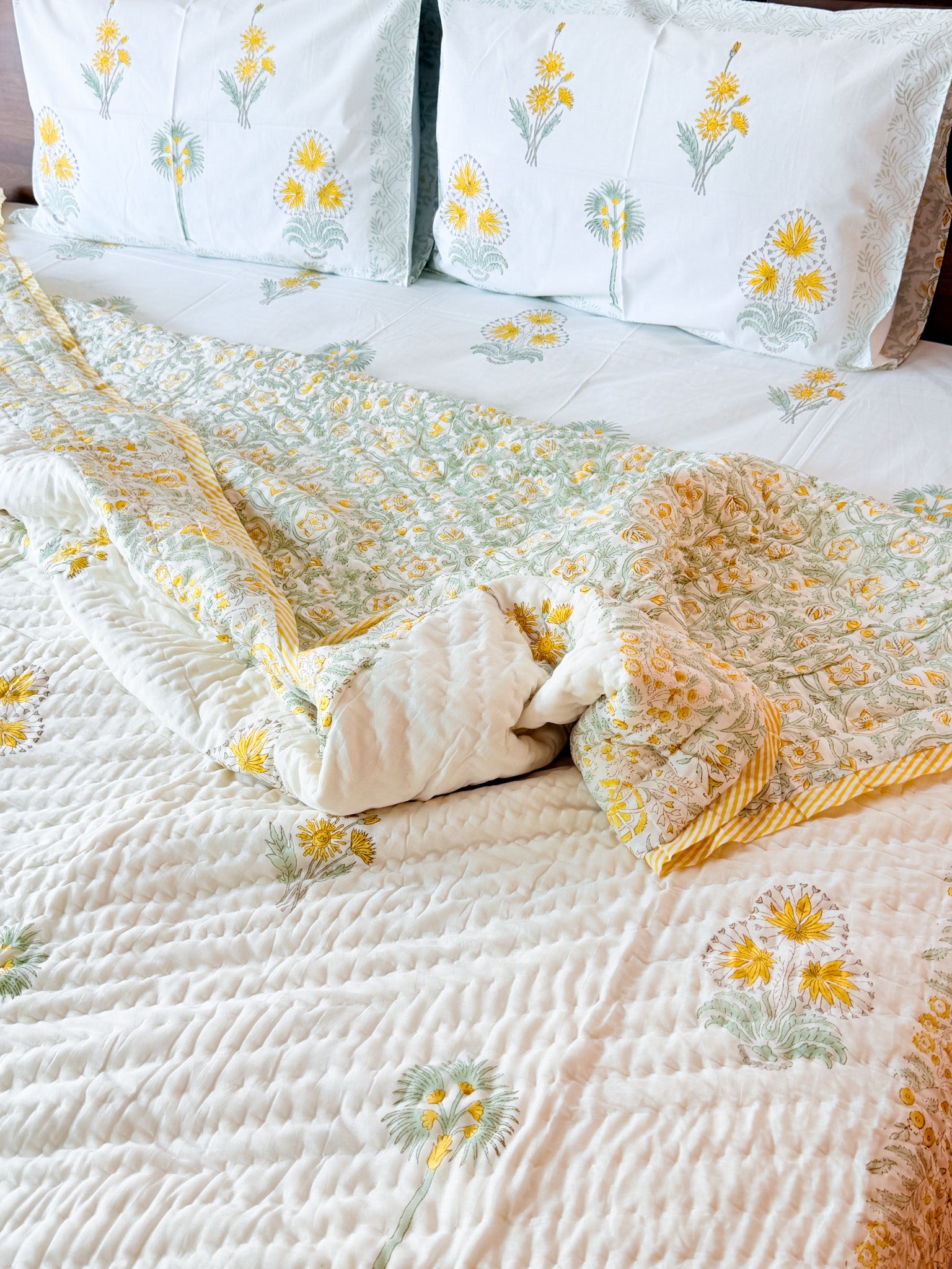 ORA Living Primrose Green Leaf Handblock Reversible Pure Mulmul Cotton Quilt shown with both printed sides