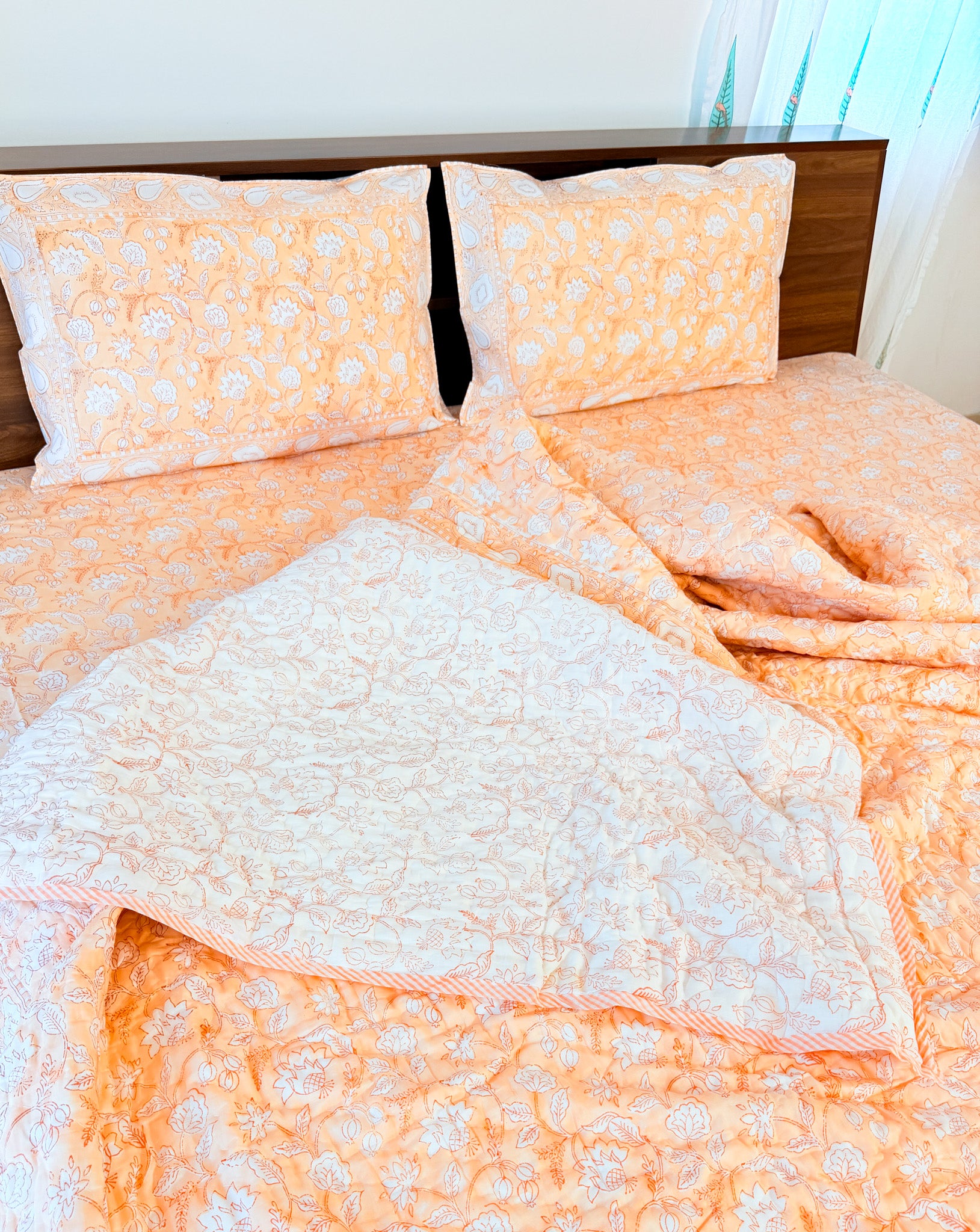 ORA Living Orange White Floral Handblock Reversible Pure Mulmul Cotton Quilt shown with both printed sides