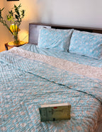 ORA Living Sky Blue White Bloom Handblock Reversible Pure Mulmul Cotton Quilt shown with both printed sides