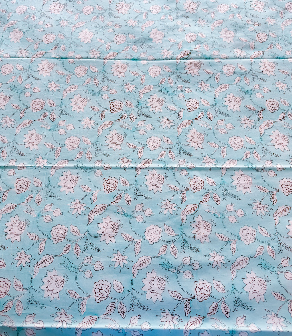 ORA Living Sky Blue White Floral Handblock Premium Cotton Bedsheet Set styled on a bed
