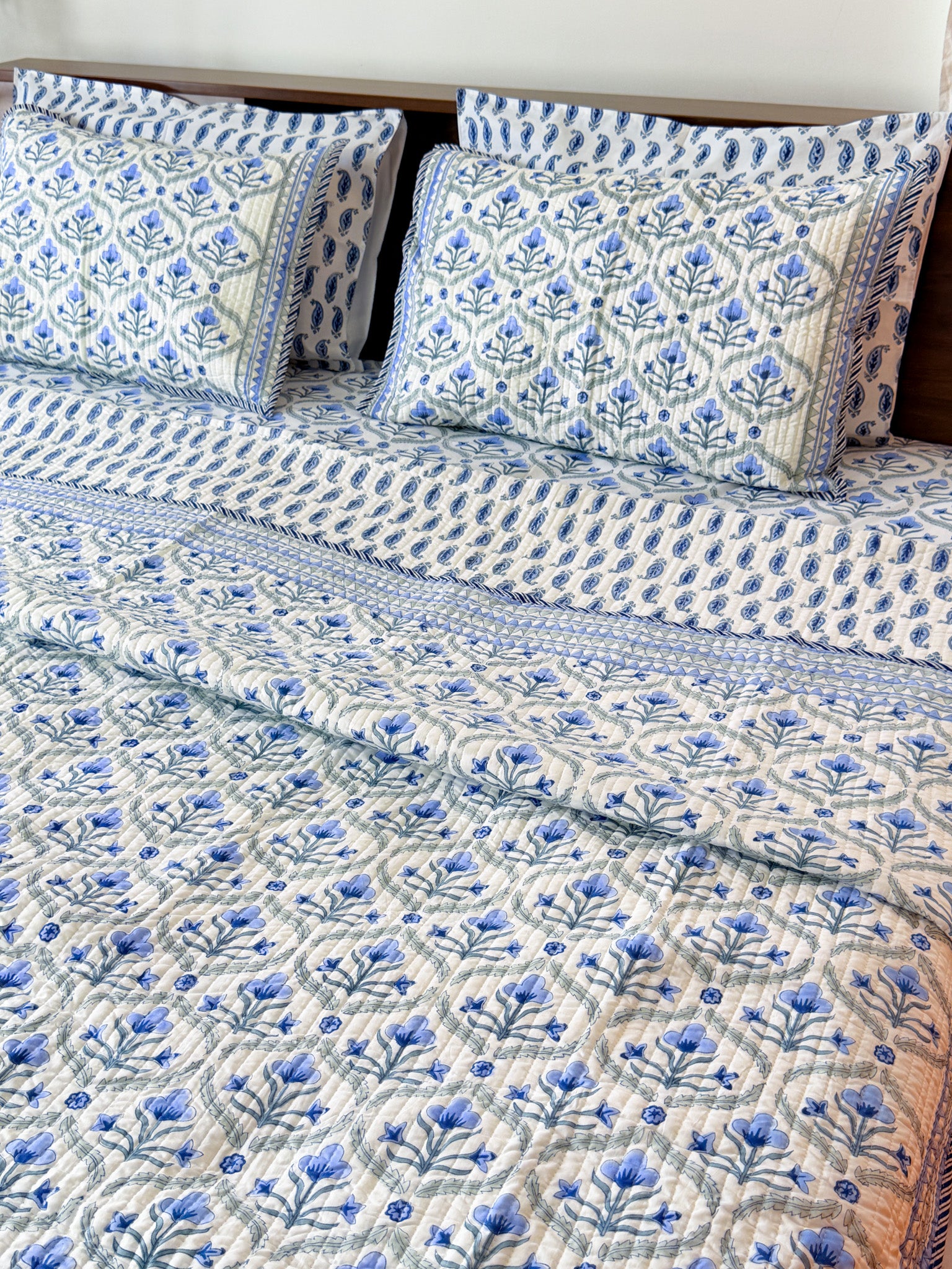Blue Floral Butta quilted bedcover full product view.